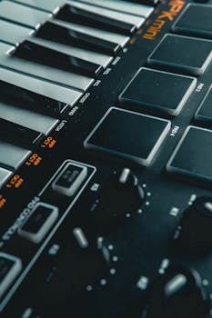Detailed view of electronic keyboard keys and control buttons, perfect for music production themes.