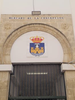 Historic Mercado de la Concepción entrance in El Puerto de Santa María, showcasing architectural heritage.